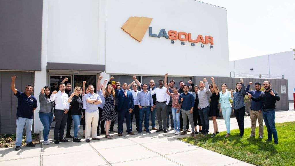 Employees-Standing-In-Front-Of-The-Office