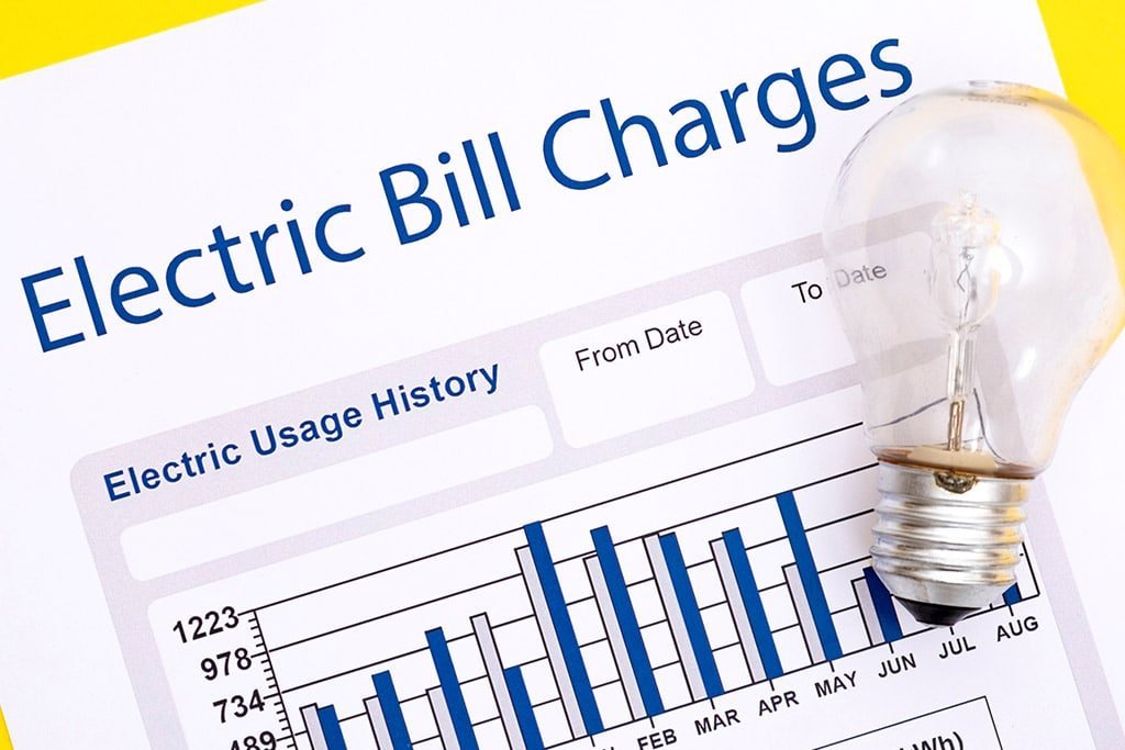 Electric bill showing usage history with a light bulb; symbolizes reducing electricity costs by combining solar power with electric vehicles – LA Solar Group